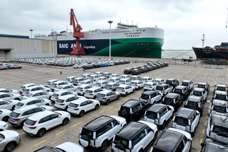 Chinese-made cars are seen on the dock before being loaded onto a ship at the port in Lianyungang, in Chinas eastern Jiangsu province on August 10, 2025. (Photo by AFP) / China OUT / CHINA OUT / CHINA OUT